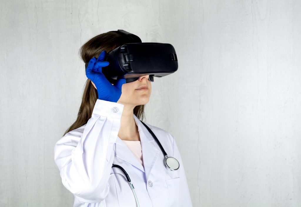 A doctor applying augmented and virtual reality (AR/VR) technology 